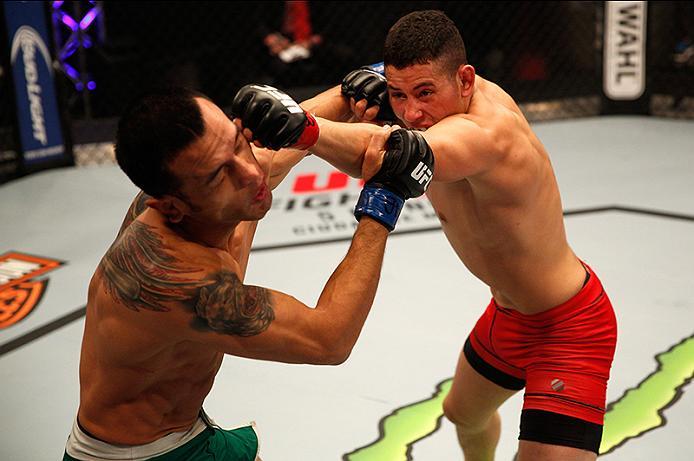 BUENOS AIRES, ARGENTINA - JUNE 11: (R-L) Martin Bravo punches Leonardo Rodriguez during the filming of The Ultimate Fighter Latin America: Team Liddell vs Team Griffin on June 11, 2016 in Buenos Aires, Argentina. (Photo by Gabriel Rossi/Zuffa LLC/Zuffa L