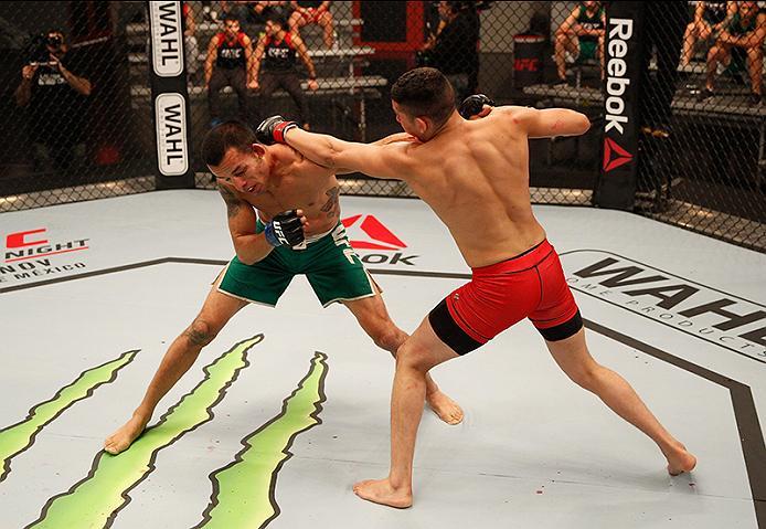 BUENOS AIRES, ARGENTINA - JUNE 11: (R-L) Martin Bravo punches Leonardo Rodriguez during the filming of The Ultimate Fighter Latin America: Team Liddell vs Team Griffin on June 11, 2016 in Buenos Aires, Argentina. (Photo by Gabriel Rossi/Zuffa LLC/Zuffa L
