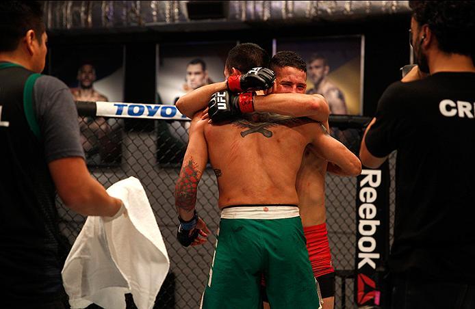 BUENOS AIRES, ARGENTINA - JUNE 11: (L-R) Leonardo Rodriguez and Martin Bravo hug each other during the filming of The Ultimate Fighter Latin America: Team Liddell vs Team Griffin on June 11, 2016 in Buenos Aires, Argentina. (Photo by Gabriel Rossi/Zuffa