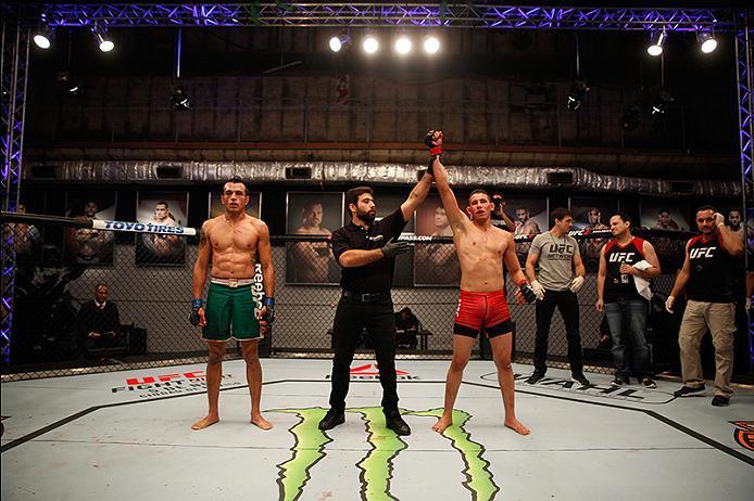 BUENOS AIRES, ARGENTINA - JUNE 11: (R-L) Martin Bravo celebrates his victory over Leonardo Rodriguez during the filming of The Ultimate Fighter Latin America: Team Liddell vs Team Griffin on June 11, 2016 in Buenos Aires, Argentina. (Photo by Gabriel Ros