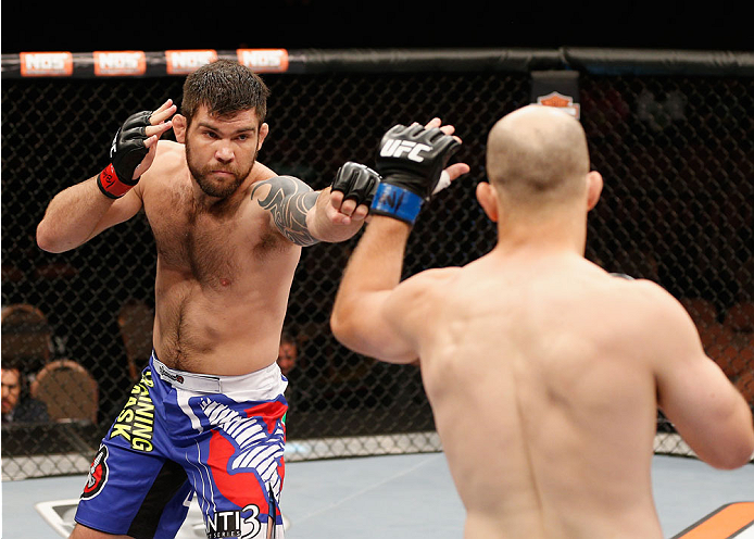 LAS VEGAS, NV - JULY 06:  (L-R) Robert Drysdale punches Keith Berish in their light heavyweight fight during the TUF 19 Finale inside the Mandalay Bay Events Center on July 6, 2014 in Las Vegas, Nevada.  (Photo by Josh Hedges/Zuffa LLC/Zuffa LLC via Getty