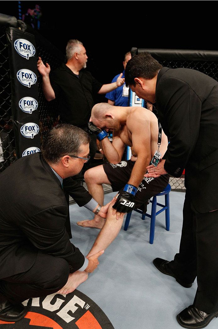 LAS VEGAS, NV - JULY 06: Keith Berish recovers after his fight with Robert Drysdale in their light heavyweight fight during the The Ultimate Fighter Finale inside the Mandalay Bay Events Center on July 6, 2014 in Las Vegas, Nevada.  (Photo by Josh Hedges/