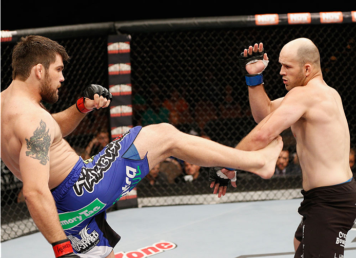 LAS VEGAS, NV - JULY 06: (L-R) Robert Drysdale kicks Keith Berish in their light heavyweight fight during the TUF 19 Finale inside the Mandalay Bay Events Center on July 6, 2014 in Las Vegas, Nevada. (Photo by Josh Hedges/Zuffa LLC/Zuffa LLC via Getty I