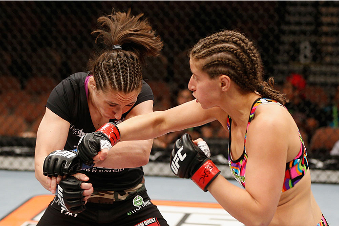 LAS VEGAS, NV - JULY 06: (R-L) Sarah Moras punches Alexis Dufresne in their women's bantamweight fight during the Ultimate Fighter Finale inside the Mandalay Bay Events Center on July 6, 2014 in Las Vegas, Nevada.  (Photo by Josh Hedges/Zuffa LLC/Zuffa LL