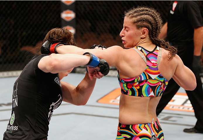 LAS VEGAS, NV - JULY 06:  (R-L) Sarah Moras punches Alexis Dufresne in their women's bantamweight fight during the Ultimate Fighter Finale inside the Mandalay Bay Events Center on July 6, 2014 in Las Vegas, Nevada.  (Photo by Josh Hedges/Zuffa LLC/Zuffa L