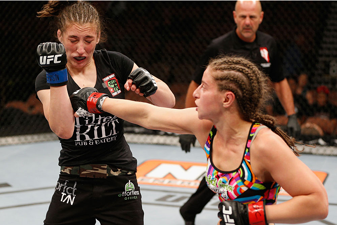 LAS VEGAS, NV - JULY 06: (R-L) Sarah Moras punches Alexis Dufresne in their women's bantamweight fight during the Ultimate Fighter Finale inside the Mandalay Bay Events Center on July 6, 2014 in Las Vegas, Nevada. (Photo by Josh Hedges/Zuffa LLC/Zuffa L