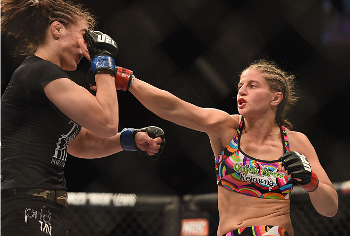 LAS VEGAS, NV - JULY 06:  (R-L) Sarah Moras punches Alexis Dufresne in their women's bantamweight fight during the Ultimate Fighter Finale inside the Mandalay Bay Events Center on July 6, 2014 in Las Vegas, Nevada.  (Photo by Jeff Bottari/Zuffa LLC/Zuffa 