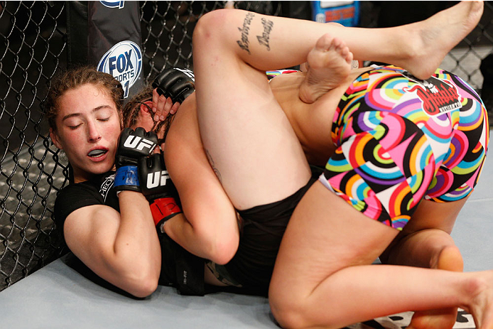 LAS VEGAS, NV - JULY 06:  Alexis Dufresne (bottom) grapples with Sarah Moras in their women's bantamweight fight during the Ultimate Fighter Finale inside the Mandalay Bay Events Center on July 6, 2014 in Las Vegas, Nevada.  (Photo by Josh Hedges/Zuffa LL