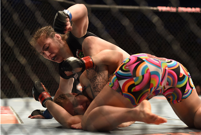 LAS VEGAS, NV - JULY 06:  Alexis Dufresne (top) punches Sarah Moras in their women's bantamweight fight during the Ultimate Fighter Finale inside the Mandalay Bay Events Center on July 6, 2014 in Las Vegas, Nevada.  (Photo by Jeff Bottari/Zuffa LLC/Zuffa 