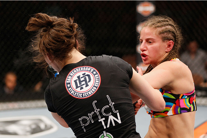 LAS VEGAS, NV - JULY 06: (R-L) Sarah Moras punches Alexis Dufresne in their women's bantamweight fight during the Ultimate Fighter Finale inside the Mandalay Bay Events Center on July 6, 2014 in Las Vegas, Nevada. (Photo by Josh Hedges/Zuffa LLC/Zuffa L