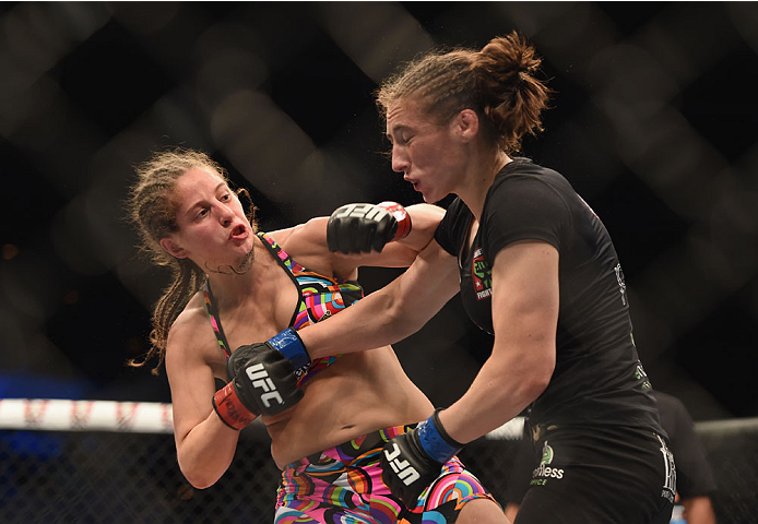 LAS VEGAS, NV - JULY 06: (L-R) Sarah Moras punches Alexis Dufresne in their women's bantamweight fight during the Ultimate Fighter Finale inside the Mandalay Bay Events Center on July 6, 2014 in Las Vegas, Nevada. (Photo by Jeff Bottari/Zuffa LLC/Zuffa