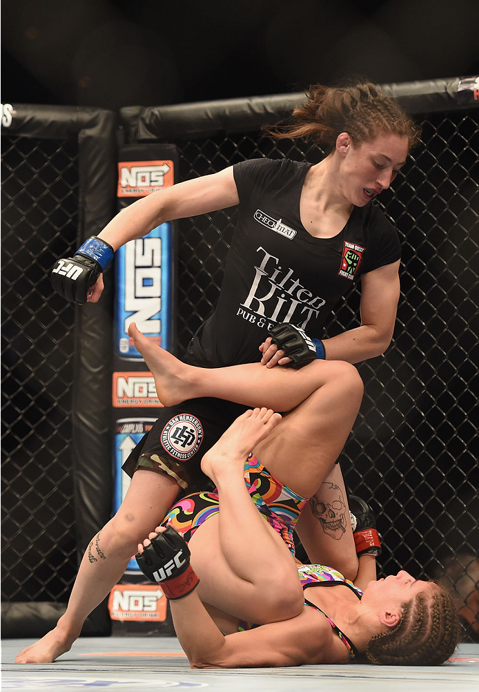 LAS VEGAS, NV - JULY 06:  Alexis Dufresne (top) punches Sarah Moras in their women's bantamweight fight during the Ultimate Fighter Finale inside the Mandalay Bay Events Center on July 6, 2014 in Las Vegas, Nevada.  (Photo by Jeff Bottari/Zuffa LLC/Zuffa 