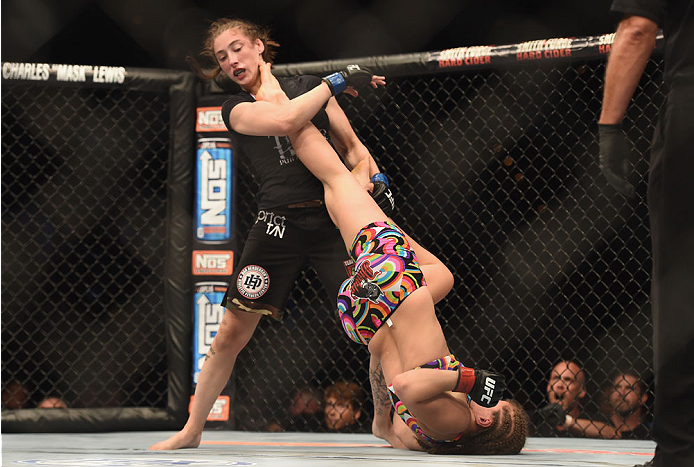 LAS VEGAS, NV - JULY 06: Alexis Dufresne (top) is kicked from below by Sarah Moras in their women's bantamweight fight during the Ultimate Fighter Finale inside the Mandalay Bay Events Center on July 6, 2014 in Las Vegas, Nevada. (Photo by Jeff Bottari/