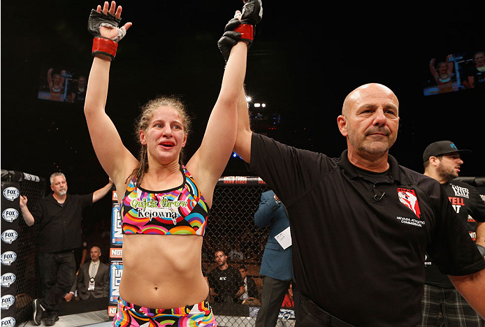 LAS VEGAS, NV - JULY 06:  Sarah Moras celebrates after defeating Alexis Dufresne in their women's bantamweight fight during the Ultimate Fighter Finale inside the Mandalay Bay Events Center on July 6, 2014 in Las Vegas, Nevada.  (Photo by Josh Hedges/Zuff