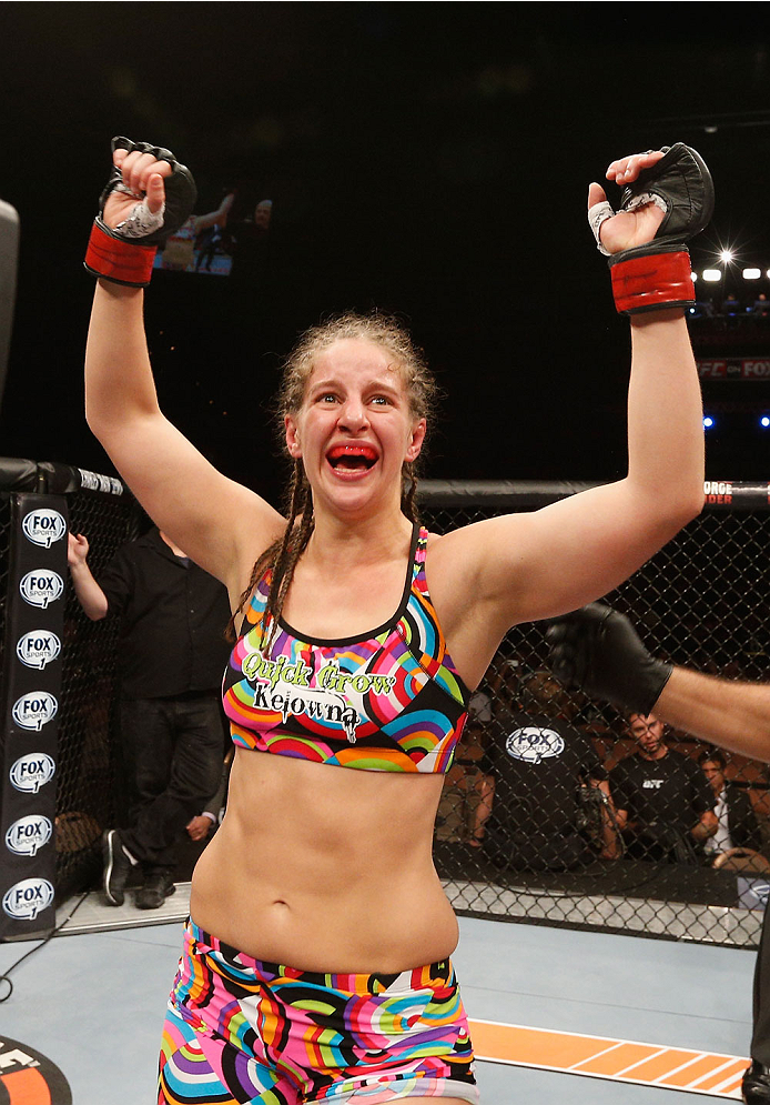 LAS VEGAS, NV - JULY 06:  Sarah Moras celebrates after defeating Alexis Dufresne in their women's bantamweight fight during the Ultimate Fighter Finale inside the Mandalay Bay Events Center on July 6, 2014 in Las Vegas, Nevada.  (Photo by Josh Hedges/Zuff