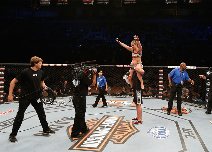 LAS VEGAS, NV - JULY 06: Sarah Moras celebrates after defeating Alexis Dufresne in their women's bantamweight fight during the Ultimate Fighter Finale inside the Mandalay Bay Events Center on July 6, 2014 in Las Vegas, Nevada. (Photo by Josh Hedges/Zuff