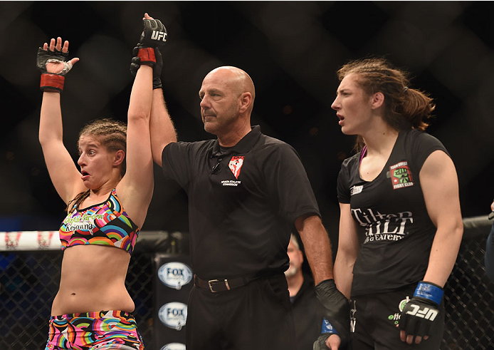 LAS VEGAS, NV - JULY 06:  (L-R) Sarah Moras reacts to her win over Alexis Dufresne in their women's bantamweight fight during the Ultimate Fighter Finale inside the Mandalay Bay Events Center on July 6, 2014 in Las Vegas, Nevada.  (Photo by Jeff Bottari/Z