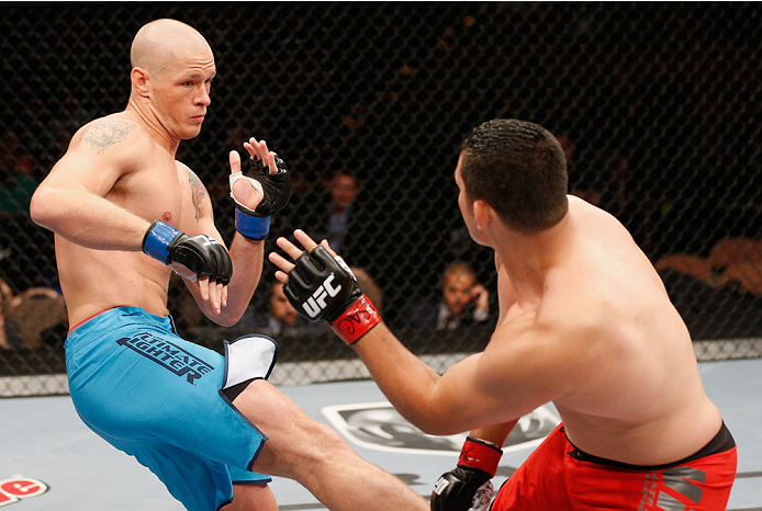 LAS VEGAS, NV - JULY 06:  (L-R) Daniel Spohn kicks Patrick Walsh in their light heavyweight fight during the Ultimate Fighter Finale inside the Mandalay Bay Events Center on July 6, 2014 in Las Vegas, Nevada.  (Photo by Josh Hedges/Zuffa LLC/Zuffa LLC via