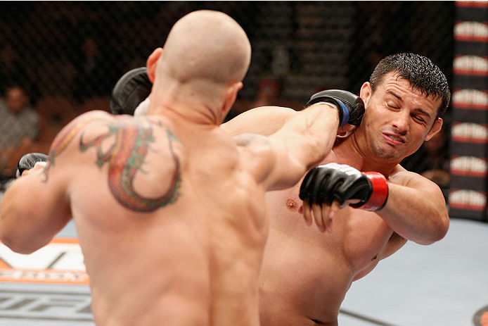 LAS VEGAS, NV - JULY 06: (L-R) Daniel Spohn and Patrick Walsh exchange punches in their light heavyweight fight during the Ultimate Fighter Finale inside the Mandalay Bay Events Center on July 6, 2014 in Las Vegas, Nevada. (Photo by Josh Hedges/Zuffa LL