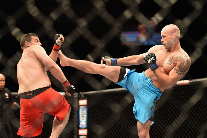 LAS VEGAS, NV - JULY 06: (R-L) Daniel Spohn kicks Patrick Walsh in their light heavyweight fight during the Ultimate Fighter Finale inside the Mandalay Bay Events Center on July 6, 2014 in Las Vegas, Nevada. (Photo by Jeff Bottari/Zuffa LLC/Zuffa LLC vi