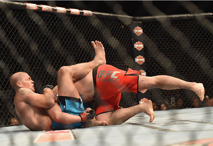 LAS VEGAS, NV - JULY 06:  Patrick Walsh (top) takes down Daniel Spohn in their light heavyweight fight during the Ultimate Fighter Finale inside the Mandalay Bay Events Center on July 6, 2014 in Las Vegas, Nevada.  (Photo by Jeff Bottari/Zuffa LLC/Zuffa L