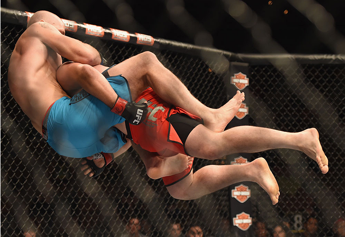LAS VEGAS, NV - JULY 06: (R-L) Patrick Walsh takes down Daniel Spohn in their light heavyweight fight during the Ultimate Fighter Finale inside the Mandalay Bay Events Center on July 6, 2014 in Las Vegas, Nevada. (Photo by Jeff Bottari/Zuffa LLC/Zuffa L