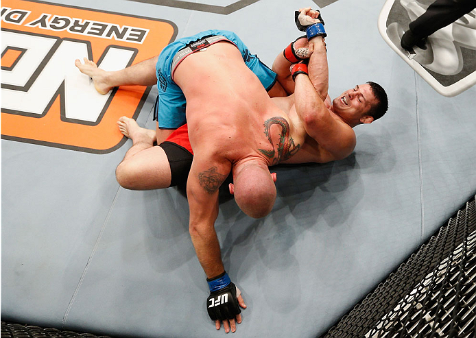 LAS VEGAS, NV - JULY 06: Patrick Walsh (bottom) attempts to submit Daniel Spohn in their light heavyweight fight during the Ultimate Fighter Finale inside the Mandalay Bay Events Center on July 6, 2014 in Las Vegas, Nevada. (Photo by Josh Hedges/Zuffa L
