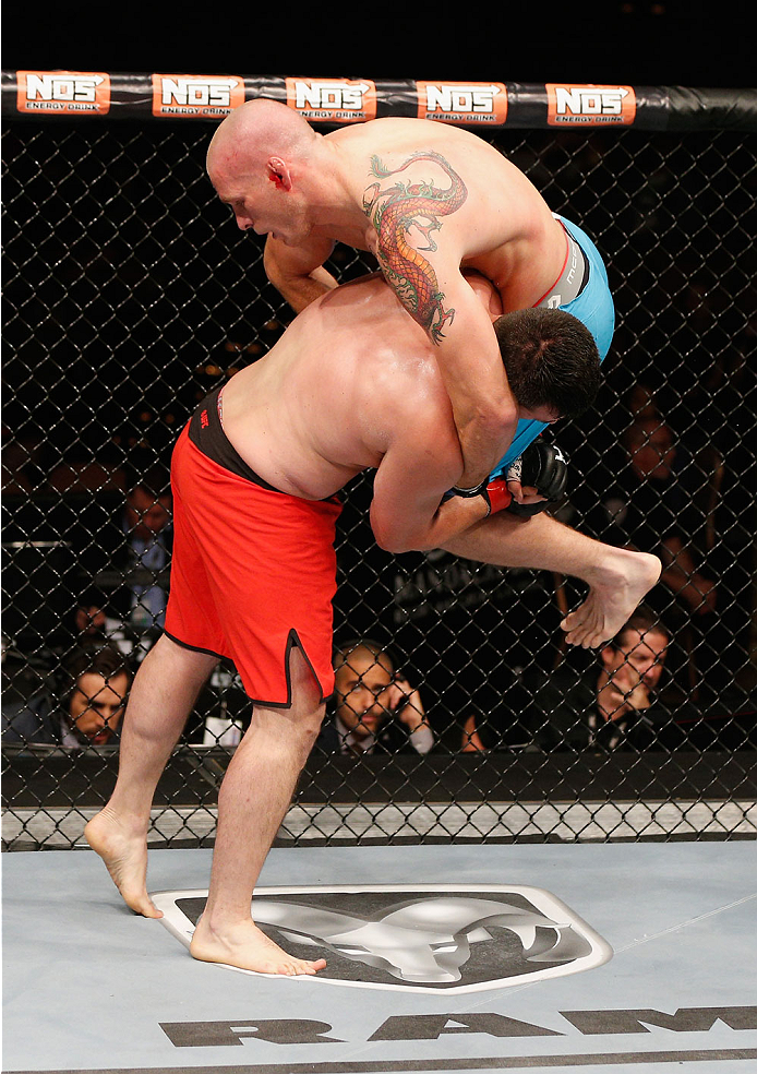 LAS VEGAS, NV - JULY 06:  (L-R) Patrick Walsh takes down Daniel Spohn in their light heavyweight fight during the Ultimate Fighter Finale inside the Mandalay Bay Events Center on July 6, 2014 in Las Vegas, Nevada.  (Photo by Josh Hedges/Zuffa LLC/Zuffa LL