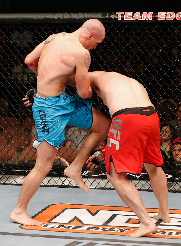 LAS VEGAS, NV - JULY 06:  (L-R) Daniel Spohn knees Patrick Walsh in their light heavyweight fight during the Ultimate Fighter Finale inside the Mandalay Bay Events Center on July 6, 2014 in Las Vegas, Nevada.  (Photo by Josh Hedges/Zuffa LLC/Zuffa LLC via