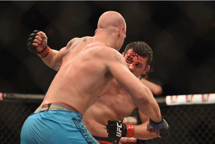 LAS VEGAS, NV - JULY 06: (R-L) Patrick Walsh and Daniel Spohn exchange punches in their light heavyweight fight during the Ultimate Fighter Finale inside the Mandalay Bay Events Center on July 6, 2014 in Las Vegas, Nevada. (Photo by Jeff Bottari/Zuffa L
