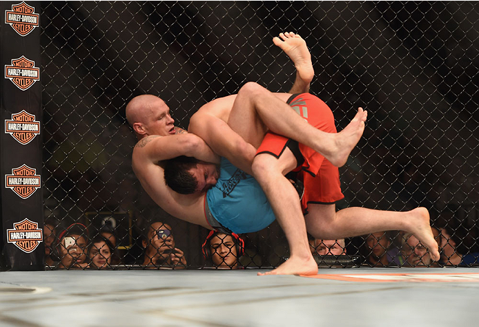 LAS VEGAS, NV - JULY 06: (R-L) Patrick Walsh takes down Daniel Spohn in their light heavyweight fight during the Ultimate Fighter Finale inside the Mandalay Bay Events Center on July 6, 2014 in Las Vegas, Nevada. (Photo by Jeff Bottari/Zuffa LLC/Zuffa L