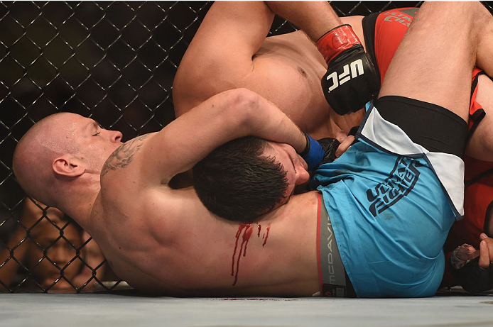 LAS VEGAS, NV - JULY 06: (L-R) Daniel Spohn attempts to lock a submission against Patrick Walsh in their light heavyweight fight during the Ultimate Fighter Finale inside the Mandalay Bay Events Center on July 6, 2014 in Las Vegas, Nevada. (Photo by Jef