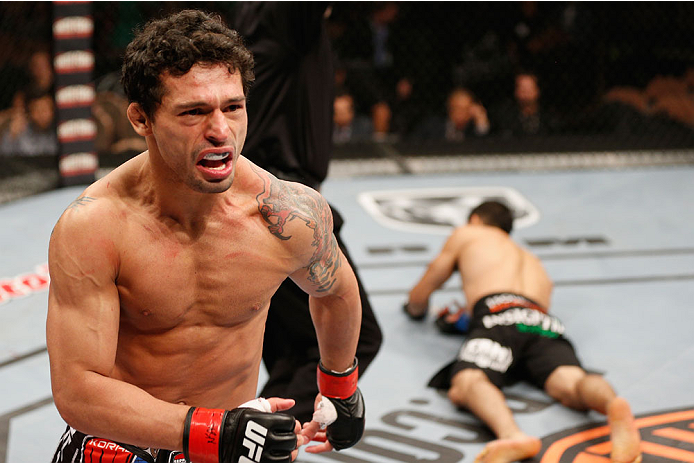 LAS VEGAS, NV - JULY 06:  Adriano Martins celebrates after knocking out Juan Maneul Puig Carreon in their lightweight fight during the Ultimate Fighter Finale inside the Mandalay Bay Events Center on July 6, 2014 in Las Vegas, Nevada.  (Photo by Josh Hedg