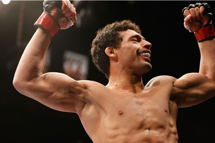 LAS VEGAS, NV - JULY 06:  Adriano Martins celebrates after knocking out Juan Maneul Puig Carreon in their lightweight fight during the Ultimate Fighter Finale inside the Mandalay Bay Events Center on July 6, 2014 in Las Vegas, Nevada.  (Photo by Josh Hedg