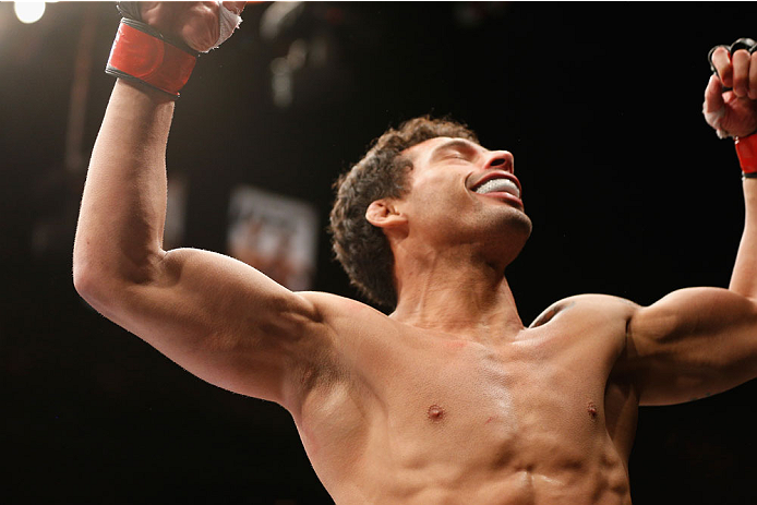 LAS VEGAS, NV - JULY 06:  Adriano Martins celebrates after knocking out Juan Maneul Puig Carreon in their lightweight fight during the Ultimate Fighter Finale inside the Mandalay Bay Events Center on July 6, 2014 in Las Vegas, Nevada.  (Photo by Josh Hedg