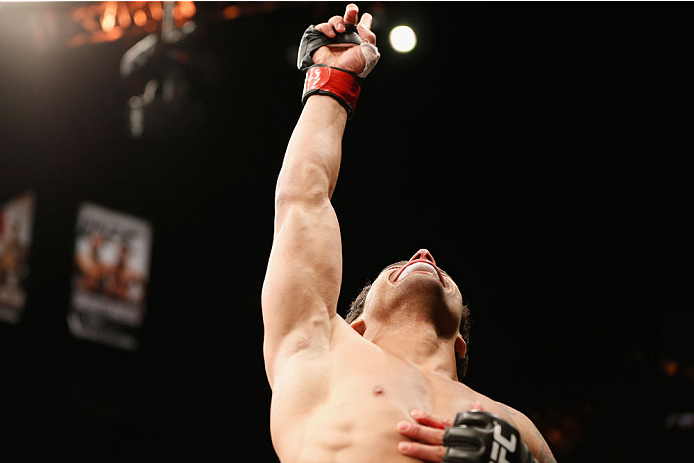 LAS VEGAS, NV - JULY 06:  Adriano Martins celebrates after knocking out Juan Maneul Puig Carreon in their lightweight fight during the Ultimate Fighter Finale inside the Mandalay Bay Events Center on July 6, 2014 in Las Vegas, Nevada.  (Photo by Josh Hedg