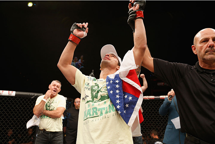 LAS VEGAS, NV - JULY 06:  Adriano Martins celebrates after knocking out Juan Maneul Puig Carreon in their lightweight fight during the Ultimate Fighter Finale inside the Mandalay Bay Events Center on July 6, 2014 in Las Vegas, Nevada.  (Photo by Josh Hedg