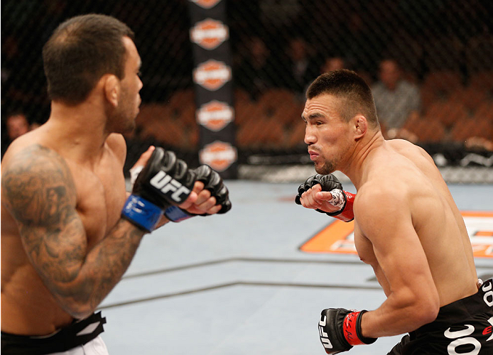LAS VEGAS, NV - JULY 06: (L-R) Leandro Issa squares off with Jumabieke Tuerxun in their bantamweight fight during the Ultimate Fighter Finale inside the Mandalay Bay Events Center on July 6, 2014 in Las Vegas, Nevada. (Photo by Josh Hedges/Zuffa LLC/Zuf