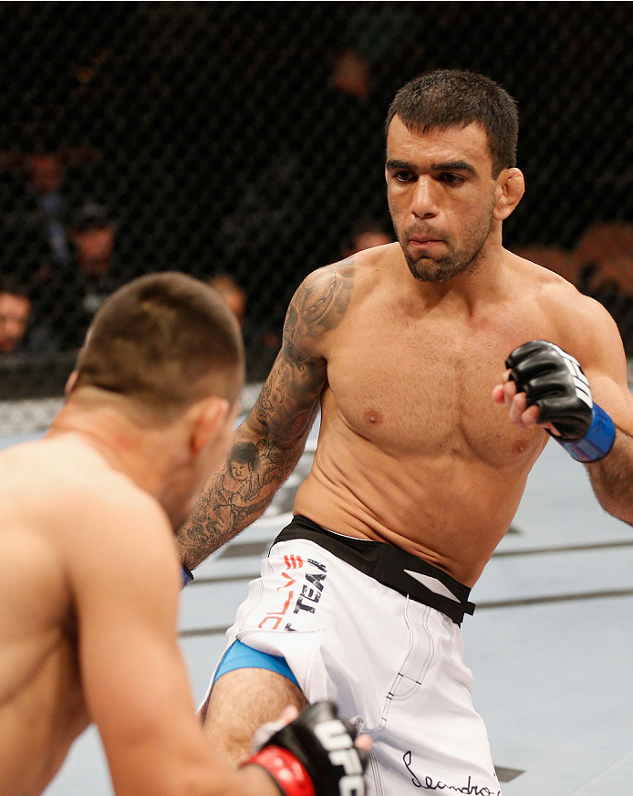 LAS VEGAS, NV - JULY 06: (R-L) Leandro Issa kicks Jumabieke Tuerxun in their bantamweight fight during the Ultimate Fighter Finale inside the Mandalay Bay Events Center on July 6, 2014 in Las Vegas, Nevada. (Photo by Josh Hedges/Zuffa LLC/Zuffa LLC via