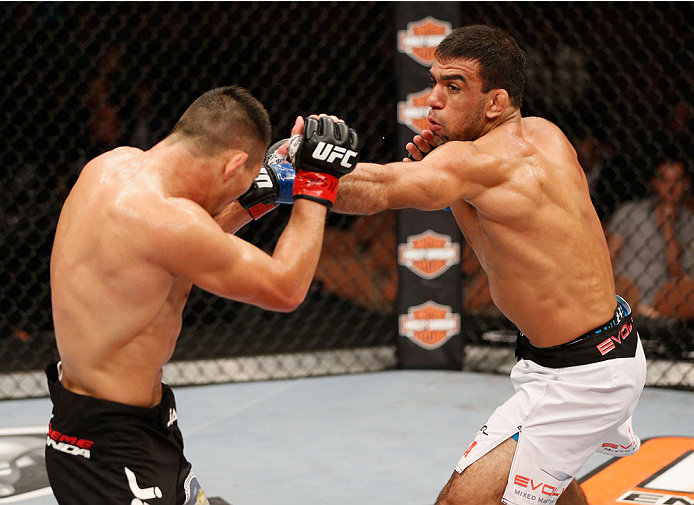 LAS VEGAS, NV - JULY 06: (R-L) Leandro Issa punches Jumabieke Tuerxun in their bantamweight fight during the Ultimate Fighter Finale inside the Mandalay Bay Events Center on July 6, 2014 in Las Vegas, Nevada. (Photo by Josh Hedges/Zuffa LLC/Zuffa LLC vi