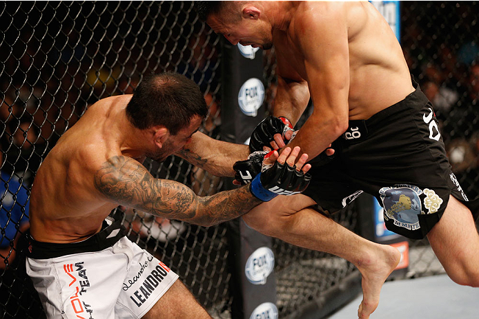 LAS VEGAS, NV - JULY 06:  (R-L) Jumabieke Tuerxun attempts a flying knee on Leandro Issa in their bantamweight fight during the Ultimate Fighter Finale inside the Mandalay Bay Events Center on July 6, 2014 in Las Vegas, Nevada.  (Photo by Josh Hedges/Zuff