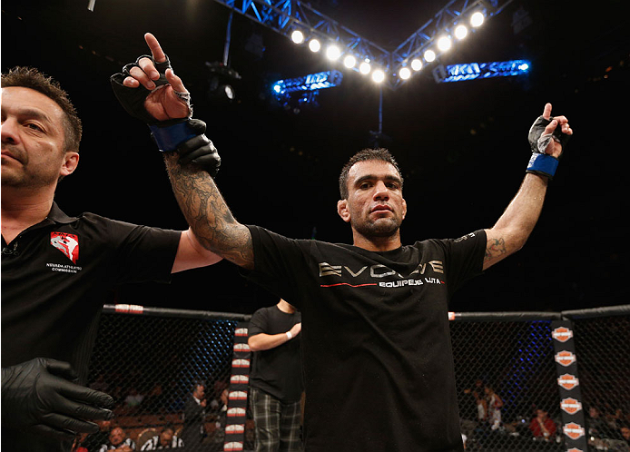 LAS VEGAS, NV - JULY 06:  Leandro Issa celebrates after submitting Jumabieke Tuerxun in their bantamweight fight during the Ultimate Fighter Finale inside the Mandalay Bay Events Center on July 6, 2014 in Las Vegas, Nevada.  (Photo by Josh Hedges/Zuffa LL