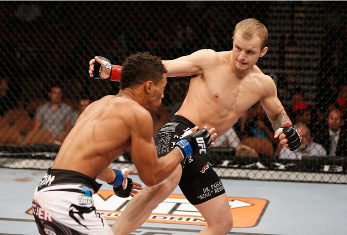 LAS VEGAS, NV - JULY 06: (R-L) Jesse Ronson kicks Kevin Lee in their flyweight fight during the Ultimate Fighter Finale inside the Mandalay Bay Events Center on July 6, 2014 in Las Vegas, Nevada. (Photo by Josh Hedges/Zuffa LLC/Zuffa LLC via Getty Image