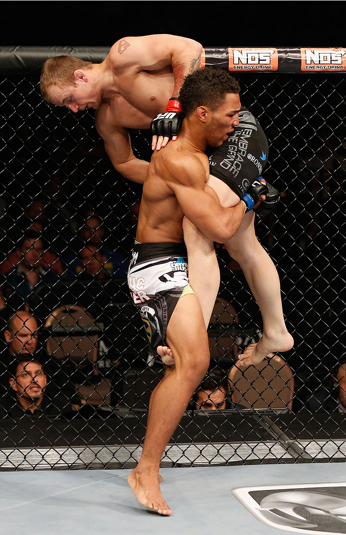 LAS VEGAS, NV - JULY 06: Kevin Lee (bottom) takes down Jesse Ronson in their flyweight fight during the Ultimate Fighter Finale inside the Mandalay Bay Events Center on July 6, 2014 in Las Vegas, Nevada. (Photo by Josh Hedges/Zuffa LLC/Zuffa LLC via Get