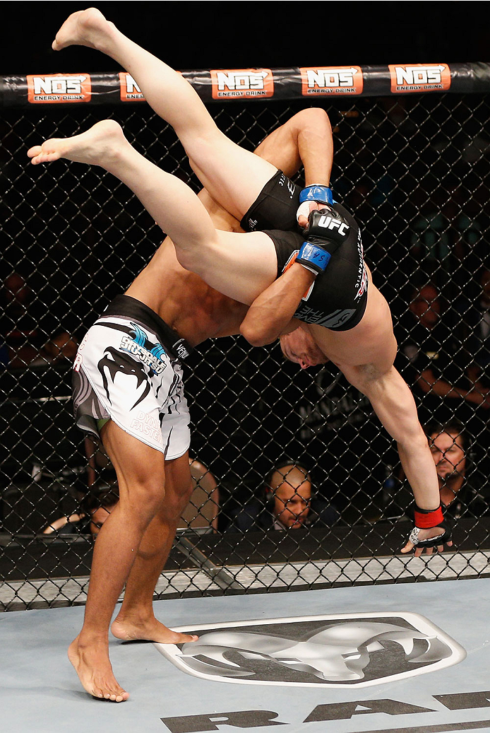 LAS VEGAS, NV - JULY 06:  Kevin Lee (bottom) takes down Jesse Ronson in their flyweight fight during the Ultimate Fighter Finale inside the Mandalay Bay Events Center on July 6, 2014 in Las Vegas, Nevada.  (Photo by Josh Hedges/Zuffa LLC/Zuffa LLC via Get