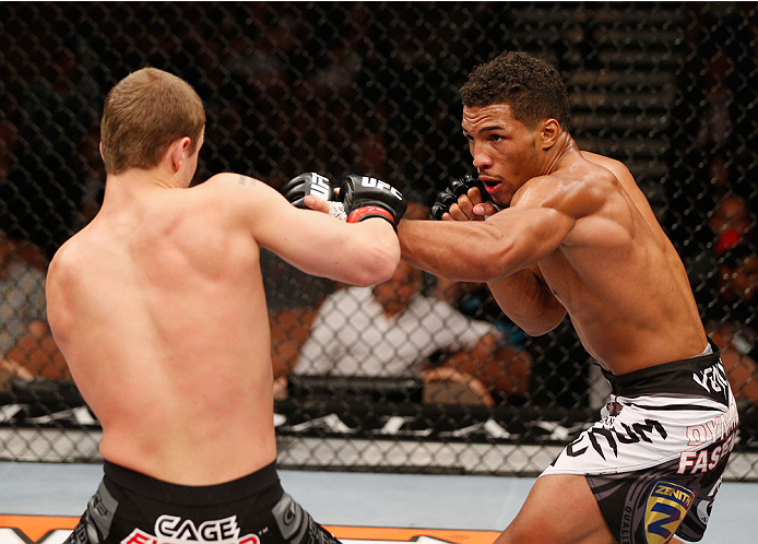LAS VEGAS, NV - JULY 06: (R-L) Kevin Lee punches Jesse Ronson in their flyweight fight during the Ultimate Fighter Finale inside the Mandalay Bay Events Center on July 6, 2014 in Las Vegas, Nevada. (Photo by Josh Hedges/Zuffa LLC/Zuffa LLC via Getty Ima
