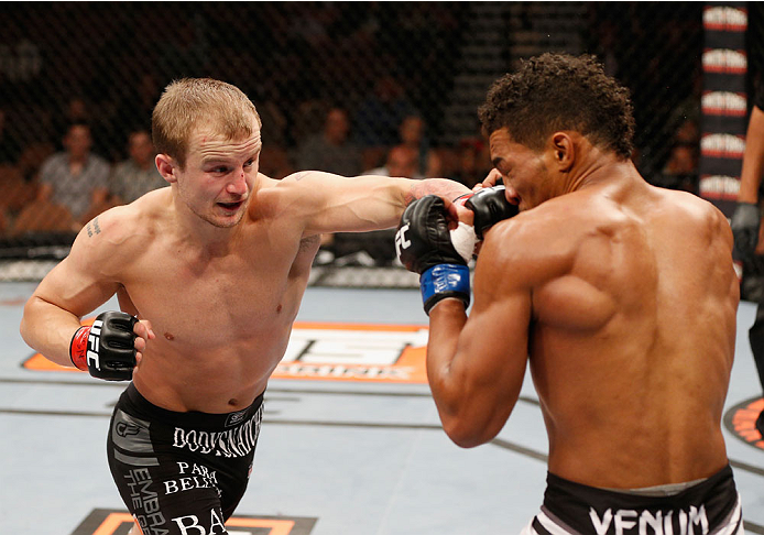 LAS VEGAS, NV - JULY 06: (L-R) Jesse Ronson punches Kevin Lee in their flyweight fight during the Ultimate Fighter Finale inside the Mandalay Bay Events Center on July 6, 2014 in Las Vegas, Nevada. (Photo by Josh Hedges/Zuffa LLC/Zuffa LLC via Getty Ima