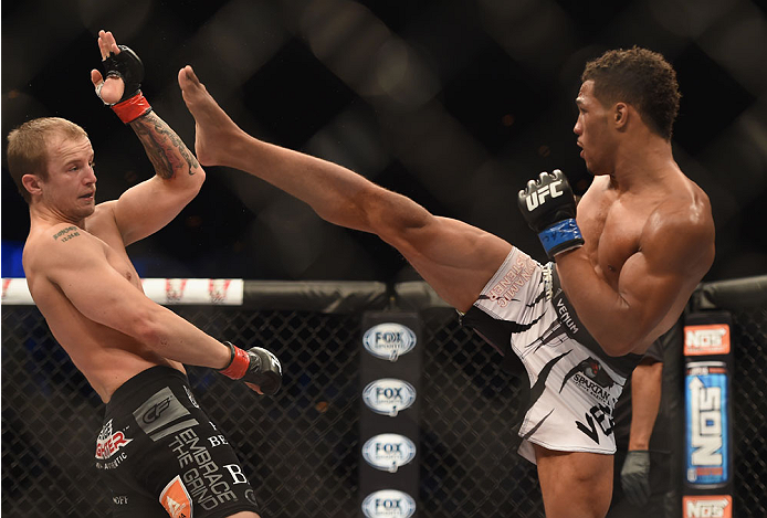 LAS VEGAS, NV - JULY 06: (R-L) Kevin Lee kicks Jesse Ronson in their flyweight fight during the Ultimate Fighter Finale inside the Mandalay Bay Events Center on July 6, 2014 in Las Vegas, Nevada. (Photo by Jeff Bottari/Zuffa LLC/Zuffa LLC via Getty Imag