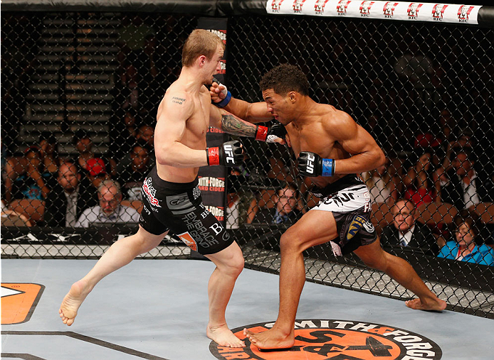 LAS VEGAS, NV - JULY 06: (R-L) Kevin Lee punches Jesse Ronson in their flyweight fight during the Ultimate Fighter Finale inside the Mandalay Bay Events Center on July 6, 2014 in Las Vegas, Nevada. (Photo by Josh Hedges/Zuffa LLC/Zuffa LLC via Getty Ima