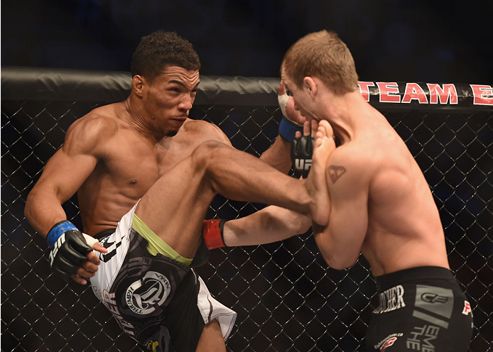 LAS VEGAS, NV - JULY 06:  (L-R) Kevin Lee kicks Jesse Ronson in their flyweight fight during the Ultimate Fighter Finale inside the Mandalay Bay Events Center on July 6, 2014 in Las Vegas, Nevada.  (Photo by Jeff Bottari/Zuffa LLC/Zuffa LLC via Getty Imag